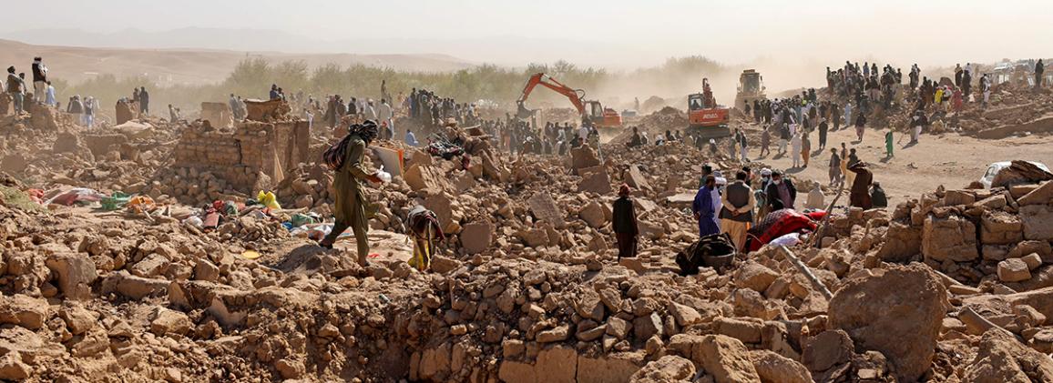 People searching through rubble following the 2023 Afghanistan earthquake
