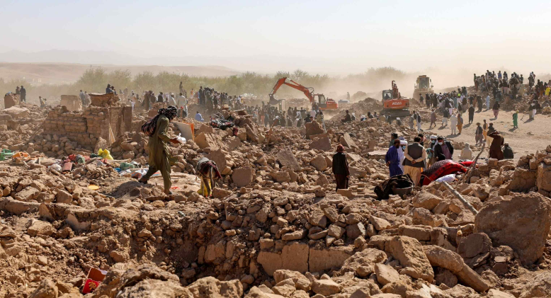 People searching through rubble following the 2023 Afghanistan earthquake