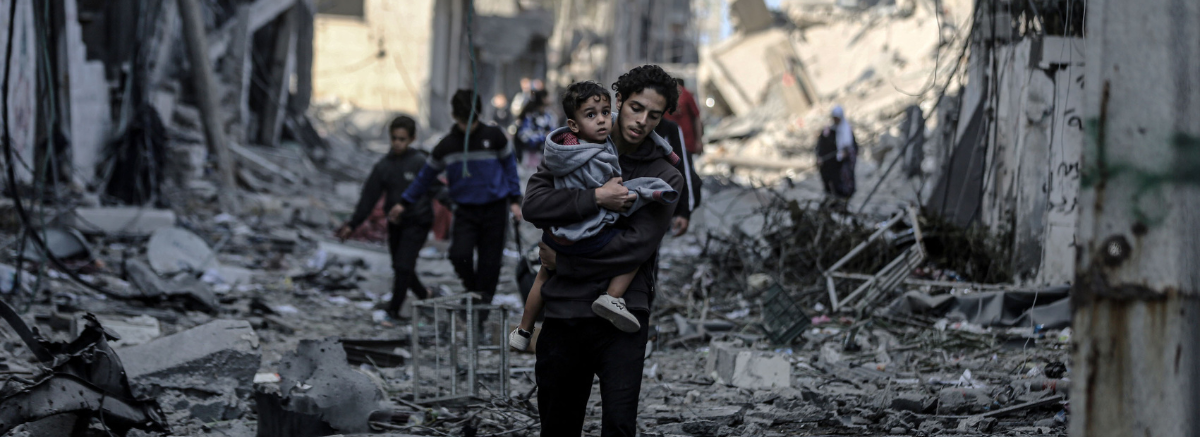 People assess the destruction cause by Israeli air strikes in Gaza City on October 7, 2023.